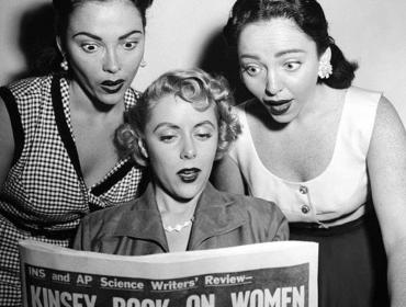 Women reading newspaper